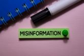 Misinformationtextonstickynotesisolatedonofficedesk
