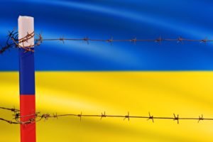 Flagsofrussianfederationandukrainedividedbybarbwire