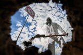 Ecologist Digging Pit By Shovel And Planting Tree In Polluted Area