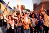 Angry Crowd Of People With Lit Torch On Public Demonstrations