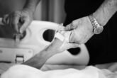 Husband Holding Hands Of His Wife In A Hospital