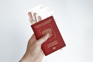 Hand Holding Russian Passport With 5000 Rubles Banknotes 181624 14506